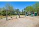 Community playground featuring swings, slides and climbing structure at 344 Riverwood Pass, Dallas, GA 30157
