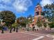 Town square featuring brick pathways, trees, benches, and clock tower at 344 Riverwood Pass, Dallas, GA 30157