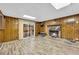 Cozy basement recreation room features a stone fireplace and wood paneling at 3734 N Camp Creek Sw Pkwy, Atlanta, GA 30331