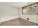 Simple bedroom with a window and pink carpet at 3734 N Camp Creek Sw Pkwy, Atlanta, GA 30331