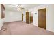 Bright bedroom with multiple doors and pink carpet at 3734 N Camp Creek Sw Pkwy, Atlanta, GA 30331