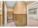 Upper hallway features wood-paneled walls and carpet at 3734 N Camp Creek Sw Pkwy, Atlanta, GA 30331