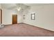 Spacious living area with vaulted ceiling and carpet at 3734 N Camp Creek Sw Pkwy, Atlanta, GA 30331