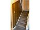 Stairs with wood paneling and carpeting at 3734 N Camp Creek Sw Pkwy, Atlanta, GA 30331