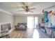 Living room with hardwood floors, fireplace, and ceiling fan at 6414 Wedgewood Trce, Tucker, GA 30084