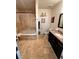 Bathroom features a tub/shower combo, granite vanity, and tile flooring at 200 Renaissance Ne Pkwy # 305, Atlanta, GA 30308