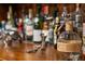 Well-stocked home bar with various liquor bottles at 4844 Elkhorn Hill Dr, Suwanee, GA 30024