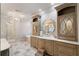 Elegant bathroom with double vanity, soaking tub, and marble floors at 4844 Elkhorn Hill Dr, Suwanee, GA 30024