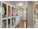 Custom walk in closet with glass doors and shelving at 4844 Elkhorn Hill Dr, Suwanee, GA 30024