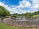 Curved wooden boardwalk path beside a tranquil lake in a lush green community at 4844 Elkhorn Hill Dr, Suwanee, GA 30024