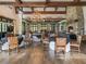 Spacious dining room with large windows and rustic wooden beams at 4844 Elkhorn Hill Dr, Suwanee, GA 30024