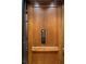 Modern elevator with wood paneling and easy controls at 4844 Elkhorn Hill Dr, Suwanee, GA 30024