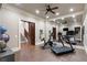 Basement home gym boasts a treadmill, exercise bike, and large mirror at 4844 Elkhorn Hill Dr, Suwanee, GA 30024