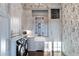 Bright laundry room with farmhouse sink, built-in cabinetry, and modern appliances at 4844 Elkhorn Hill Dr, Suwanee, GA 30024