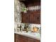 Custom wet bar with wine storage and unique cabinetry at 4844 Elkhorn Hill Dr, Suwanee, GA 30024