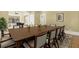 Formal dining room with large table, seating for twelve, and hardwood floors at 5288 East Cherokee Dr, Canton, GA 30115