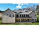 House rear view, featuring a large deck and metal roof at 5288 East Cherokee Dr, Canton, GA 30115