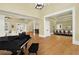 Grand great room featuring hardwood floors and a piano at 5288 East Cherokee Dr, Canton, GA 30115