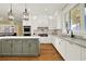 Modern kitchen featuring island, stainless steel appliances, and hardwood floors at 5288 East Cherokee Dr, Canton, GA 30115