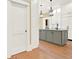 Modern kitchen with gray cabinets and hardwood floors at 5288 East Cherokee Dr, Canton, GA 30115