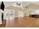 Open living room with hardwood floors, fireplace, and built-ins at 5288 East Cherokee Dr, Canton, GA 30115