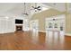 Open living area showcasing hardwood floors and a fireplace at 5288 East Cherokee Dr, Canton, GA 30115