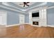 Spacious living room with hardwood floors, fireplace, and built-in shelving at 5288 East Cherokee Dr, Canton, GA 30115