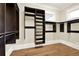 Large walk-in closet with custom built-in shelving and rods at 5288 East Cherokee Dr, Canton, GA 30115