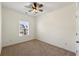 Bright bedroom with ceiling fan and neutral carpeting at 1503 Dolcetto Nw Trce # 2, Kennesaw, GA 30152