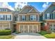 Charming townhome featuring a stone and siding facade with an attached two-car garage in a well-manicured community at 1503 Dolcetto Nw Trce # 2, Kennesaw, GA 30152