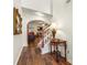 Welcoming foyer showcasing hardwood floors, staircase, and an arched doorway leading to the living room at 1503 Dolcetto Nw Trce # 2, Kennesaw, GA 30152