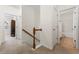 Upstairs hallway with carpet, leading to bedrooms and bath at 1503 Dolcetto Nw Trce # 2, Kennesaw, GA 30152