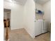 Convenient laundry room with washer, dryer, and shelving at 1503 Dolcetto Nw Trce # 2, Kennesaw, GA 30152