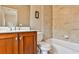 Updated bathroom with wood vanity, tile shower, and bathtub at 25 High Gate Trl, Decatur, GA 30030