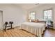 Spacious guest bedroom with king-size bed and hardwood floors at 25 High Gate Trl, Decatur, GA 30030