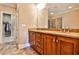 Bathroom boasts double vanity, granite countertop and large mirror at 25 High Gate Trl, Decatur, GA 30030