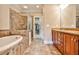 Luxurious bathroom with soaking tub, walk-in shower, and double vanity at 25 High Gate Trl, Decatur, GA 30030