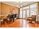 Elegant music room featuring a grand piano, hardwood floors, and large windows at 25 High Gate Trl, Decatur, GA 30030