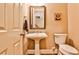 Modern powder room with pedestal sink and white toilet at 25 High Gate Trl, Decatur, GA 30030