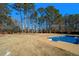 Large backyard with grassy area and refreshing pool at 8951 Country Club Dr, Douglasville, GA 30134