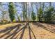 Spacious backyard with tall trees and a fence at 2833 Lynda Pl, Decatur, GA 30032