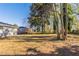 Large backyard with mature trees and partial fence at 2833 Lynda Pl, Decatur, GA 30032
