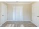 Spacious bedroom with neutral walls and carpet, featuring double closets and two entry doors at 2833 Lynda Pl, Decatur, GA 30032