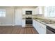 Updated kitchen with granite countertops and stainless steel appliances at 2833 Lynda Pl, Decatur, GA 30032