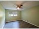 Spacious bedroom with light walls, wood-look floors, and a ceiling fan at 4617 Dunover Cir, Dunwoody, GA 30360