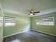 Bedroom with light green walls, gray flooring, and window blinds at 4617 Dunover Cir, Dunwoody, GA 30360