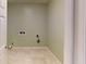 Simple laundry room with tile floor and space for washer and dryer at 4617 Dunover Cir, Dunwoody, GA 30360