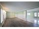 Spacious living room with light green walls and dark gray floors at 4617 Dunover Cir, Dunwoody, GA 30360