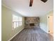 Living room with stone fireplace and gray vinyl flooring at 4617 Dunover Cir, Dunwoody, GA 30360