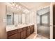 Double vanity bathroom with a view into a spacious bedroom at 1600 Watercress Se Ct, Mableton, GA 30126